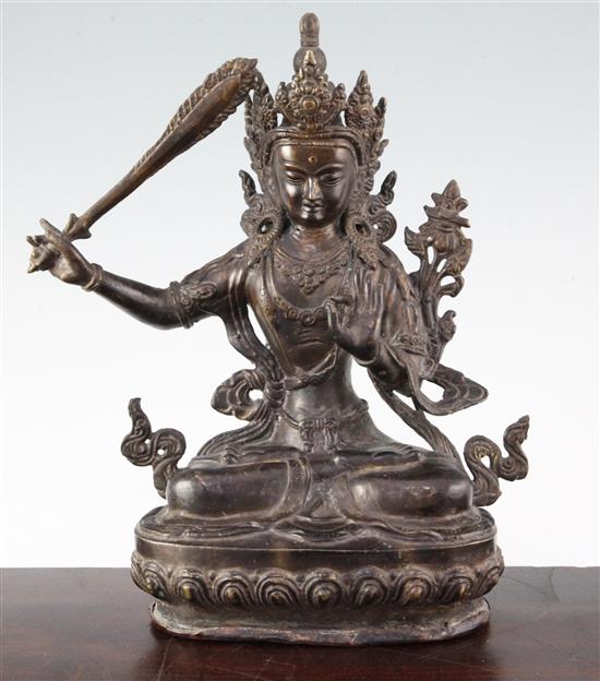 A Sino-Tibetan bronze seated figure of Manjushri, 31cm